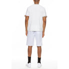 Back view of man wearing white vacation casual shorts for men by WEIV with a white t-shirt and black socks