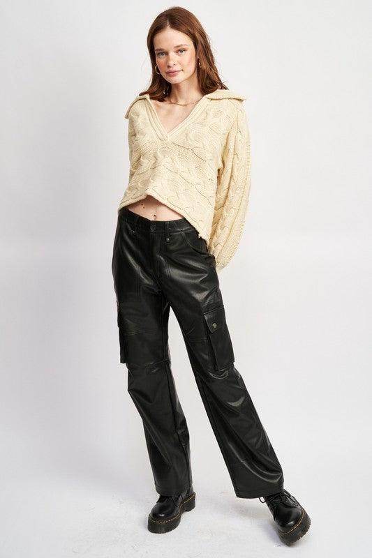 Emory Park women's sweater styled as part of vacation outfit ideas with black cargo pants