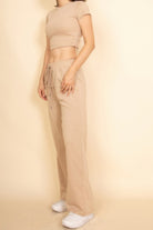 Casual beige crop top and jogger set, perfect for vacation outfits for women