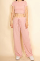 Pink crop top and wide-leg pants set for stylish vacation outfits for women