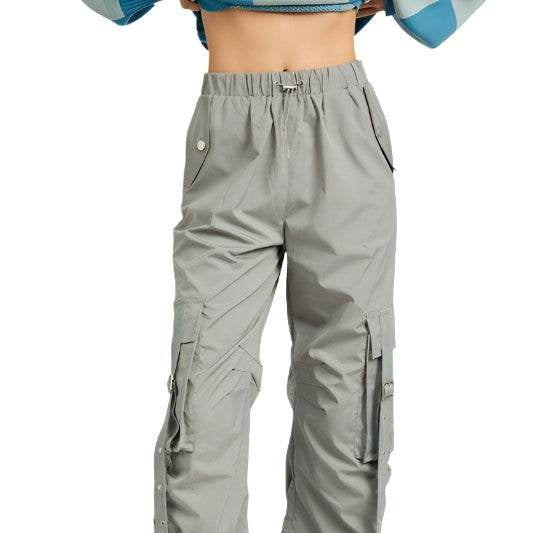 Emory Park women's vacation style cargo pants in light gray with utility pockets and adjustable straps