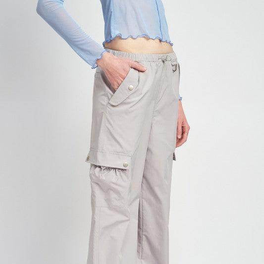 Emory Park women's vacation style cargo pants in light gray with utility pockets and a relaxed fit
