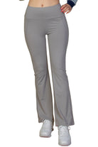VacationGrabs women's gray vacation style flare leg trousers paired with white sneakers