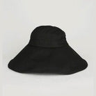 Bella Chic black vacation style hat with a wide brim for sun protection and stylish outdoor wear
