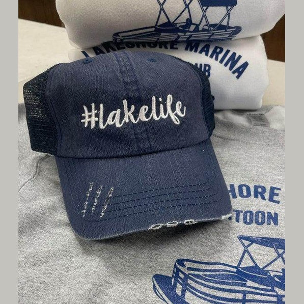 Ocean and 7th vacation trucker cap in navy blue with hashtag lake life design for summer trips