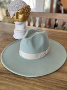 Light blue vegan felt panama hat with a white band, perfect for stylish sun protection