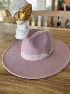 Light pink vegan felt panama hat with a stylish ribbon band, perfect for summer outfits
