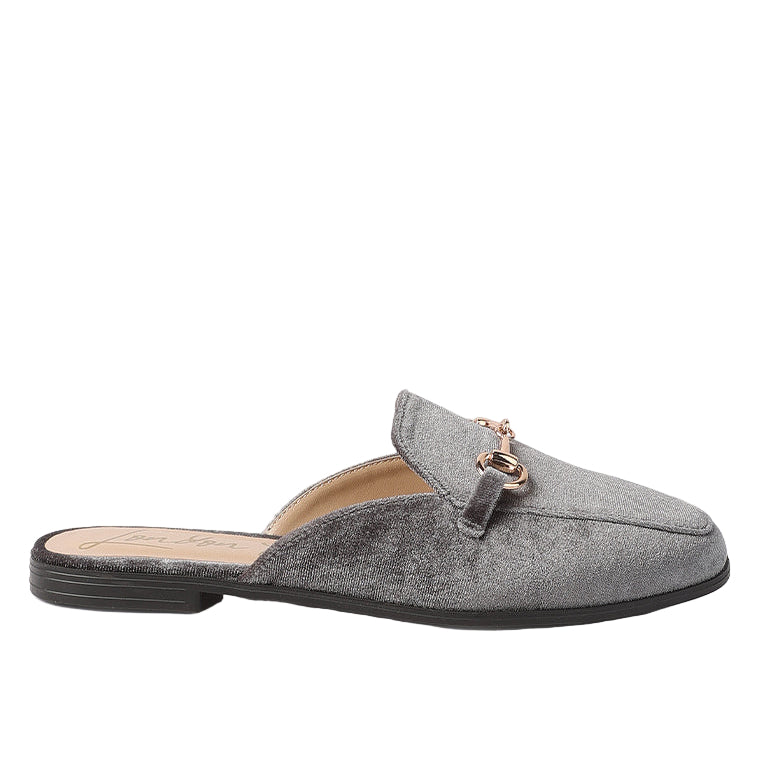 Gray slip-on shoe with a decorative strap on a white background