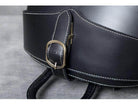 Close-up of the buckle on the VacationGrabs accordion beetle daypack showcasing its durable leather design