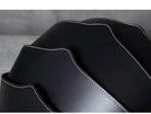 Close-up of Accordion Beetle Daypack in sleek black design with unique wave pattern