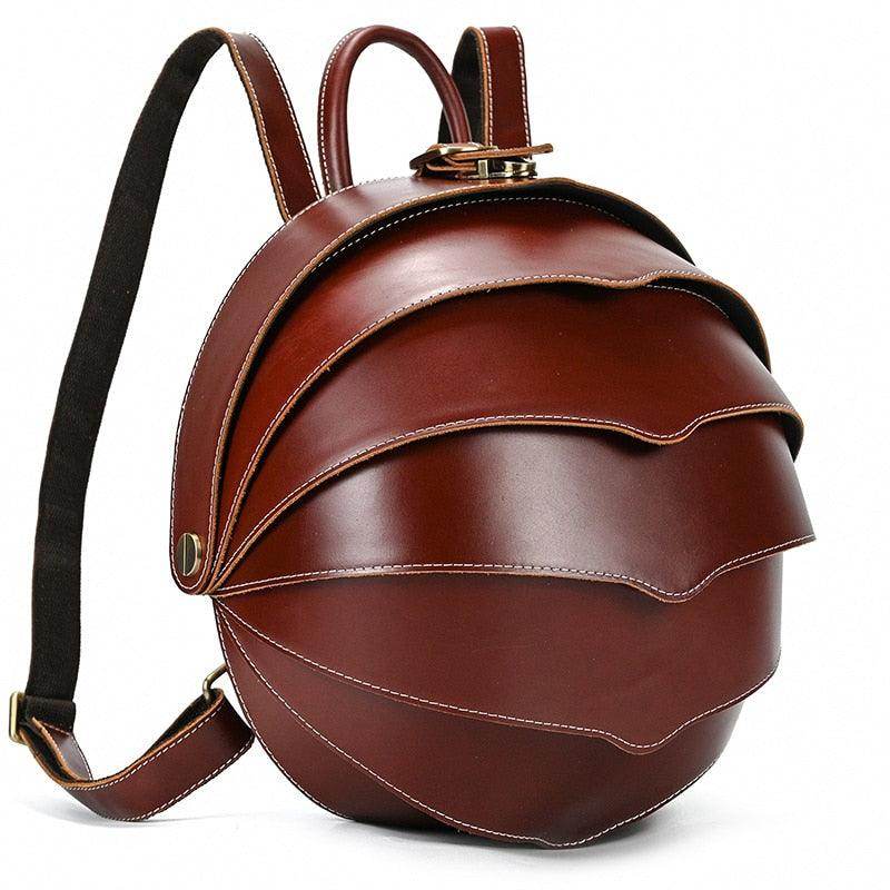 Accordion beetle daypack in brown leather with a unique layered design for stylish carrying