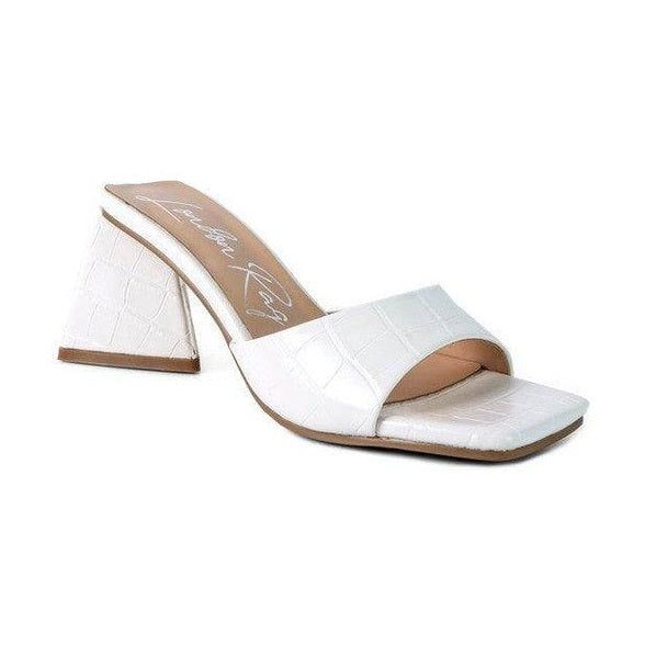 White block heel vacation sandals with a stylish design for chic summer outings