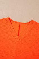 YNIQUE bright orange textured v-neck top perfect casual vacation outfit for women
