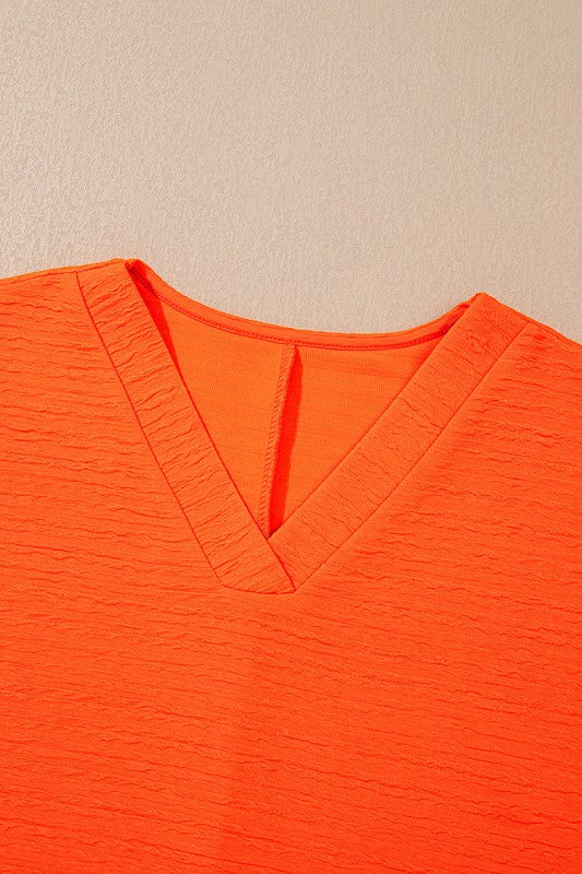 YNIQUE bright orange textured v-neck top perfect casual vacation outfit for women