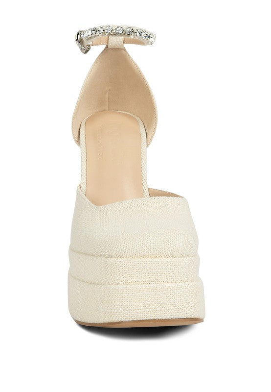 Women's embellished ankle strap heels in cream with a platform design