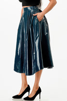 VacationGrabs shiny dark blue flowy midi skirt with pockets worn with black heels