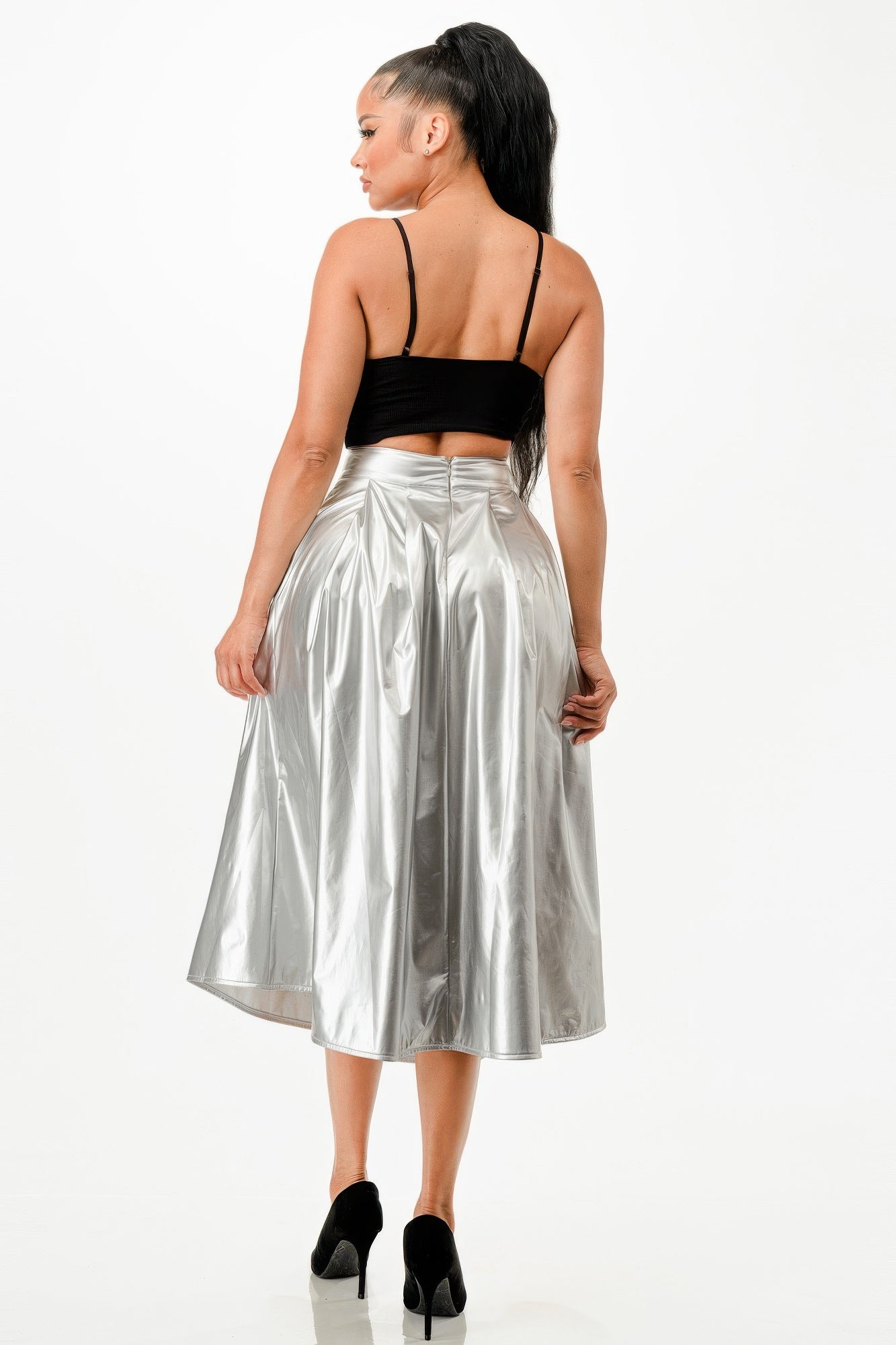 VacationGrabs flowy midi skirt with pockets in shiny silver worn with black top and heels