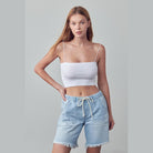 Denim Lab USA frayed hem drawstring jean shorts in light blue worn by woman with white crop top
