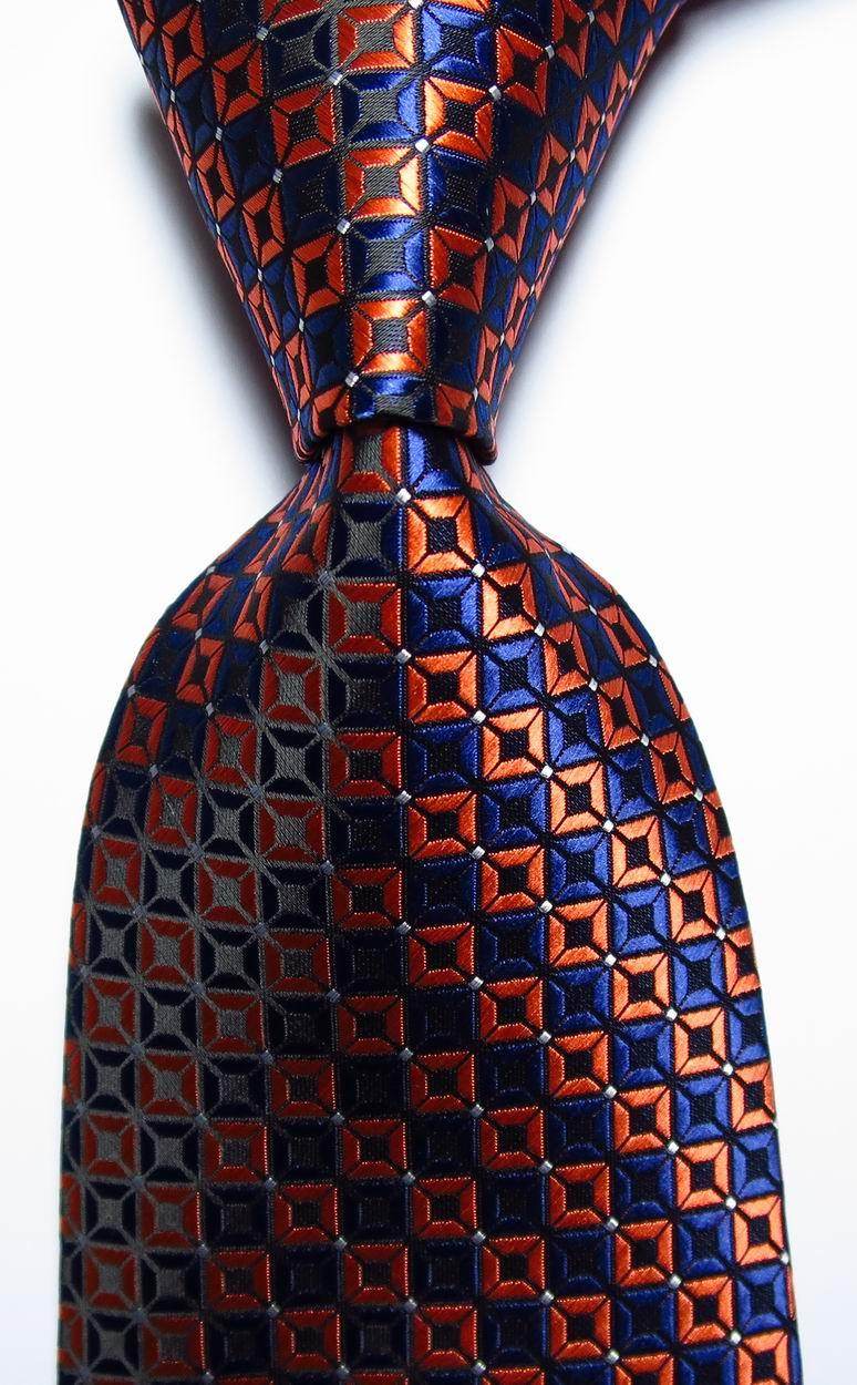 Stylish gold green necktie set featuring a geometric pattern design for formal occasions