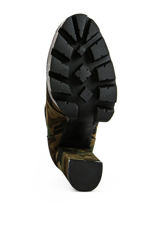 Bottom sole view of Rag Company ladies lace up snakeskin ankle boots with textured tread