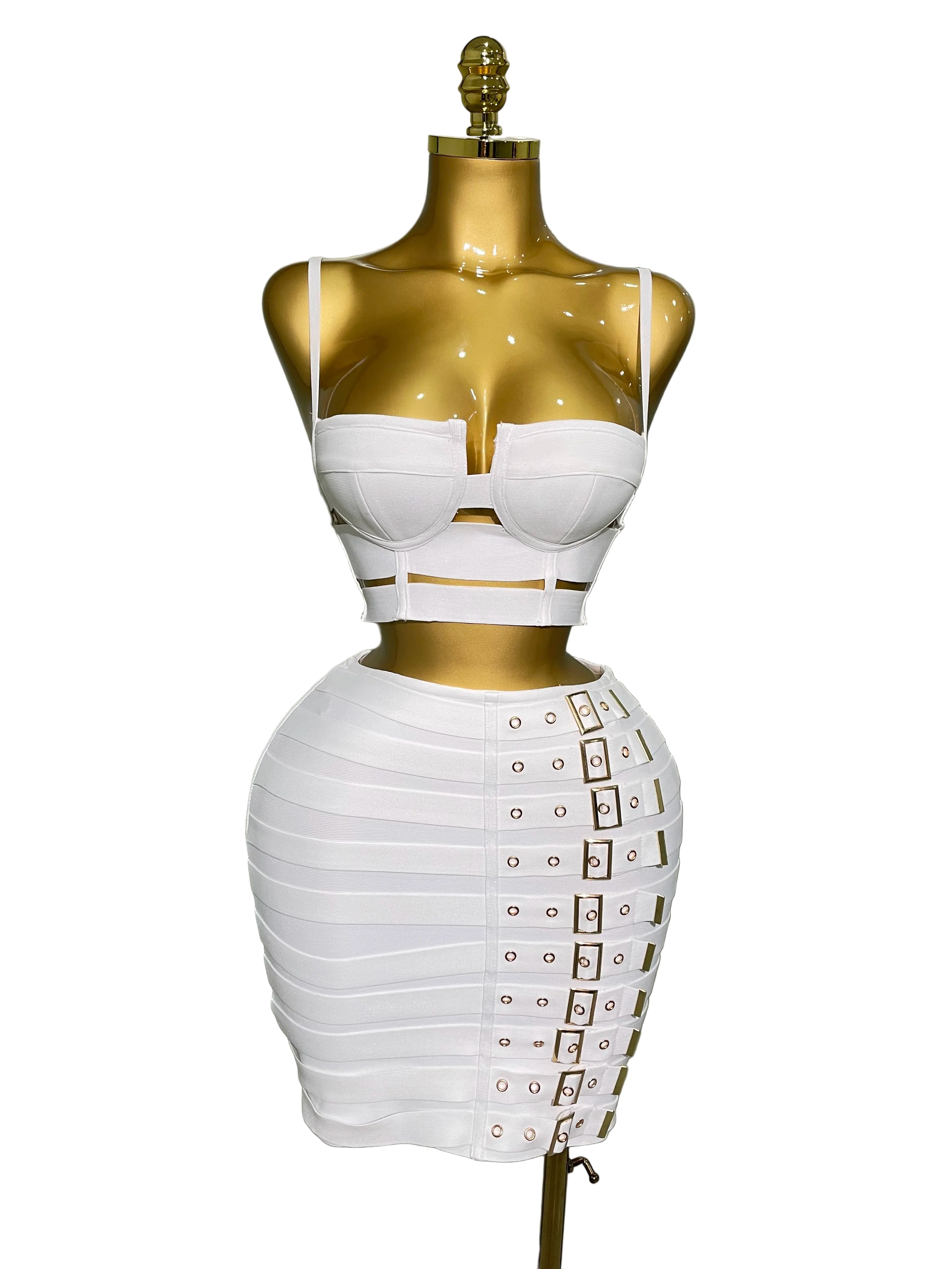 White sexy club outfit for women with strappy crop top and buckle detailed mini skirt on gold mannequin