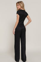 Woman modeling black vacation casual two piece set with short sleeves and wide leg pants from VacationGrabs
