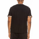 Back view of men's checkered short sleeve tee by WEIV with checkered trim on sleeves and collar