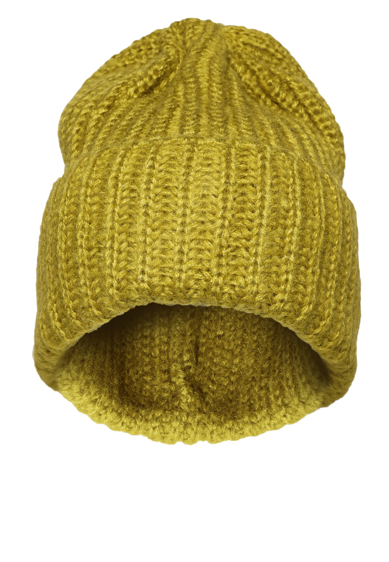 Yellow knitted beanie on a white background