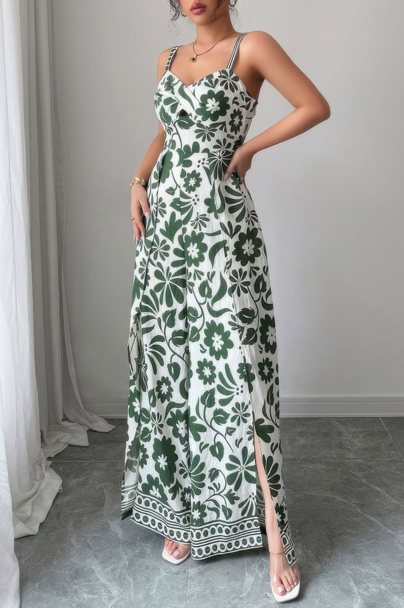 White and green floral wide leg vacation jumpsuit with a fitted bodice and side slits for a stylish beach look