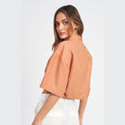 Emory Park wide sleeve crop top in rust color with a relaxed fit and short sleeves