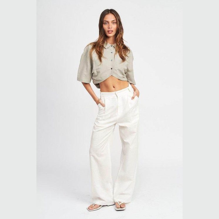 Emory Park wide sleeve crop top in light grey with a button-up design, paired with white pants
