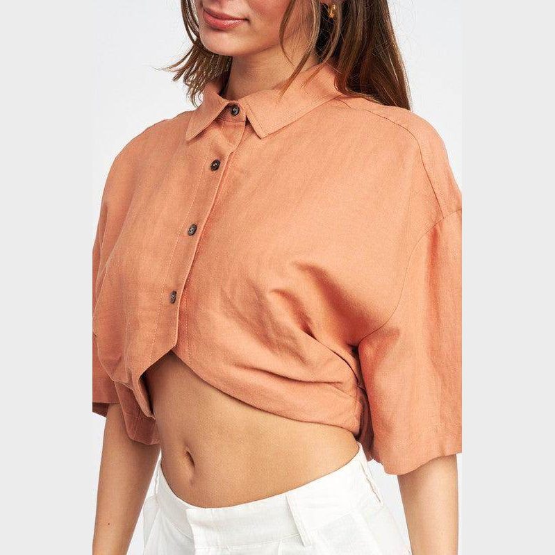 Emory Park wide sleeve crop top in soft peach color with button details and relaxed fit for stylish comfort