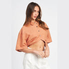 Emory Park wide sleeve crop top in terracotta with button details for a trendy summer look