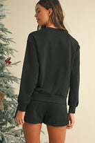Womens cozy Christmas matching set black sweatshirt and shorts by SHEWIN INC with relaxed fit