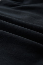 Close-up of soft black fabric texture for womens cozy Christmas matching set by SHEWIN INC