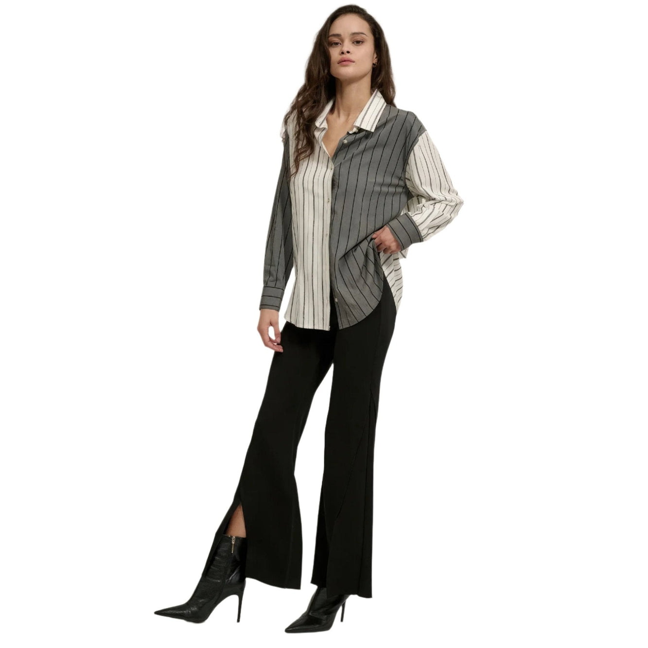 VacationGrabs womens flare pants in black with front slit paired with black pointed heel boots