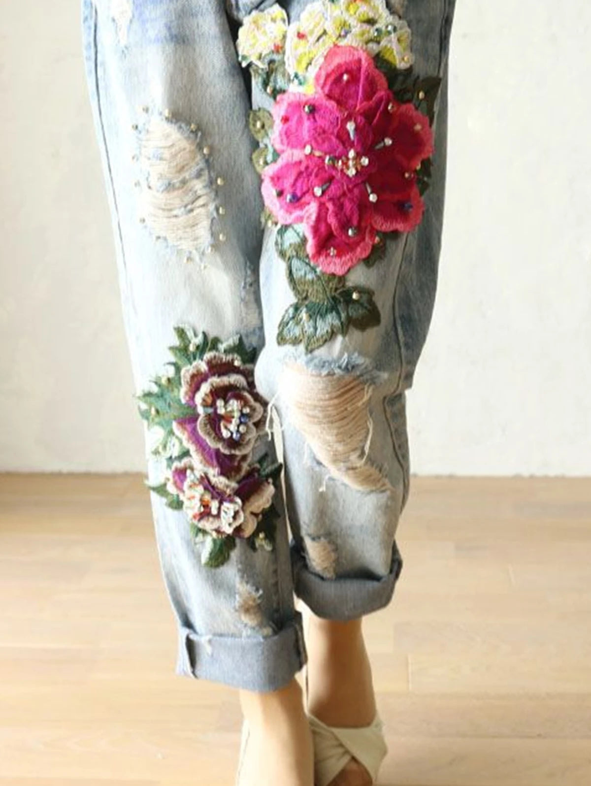 Womens floral embroidery jeans by VacationGrabs with colorful stitched flowers and distressed details