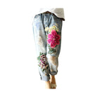 Womens floral embroidery jeans with colorful large floral designs and distressed detailing