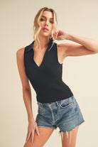 Aemi + Co women's henley tank top in black, featuring a stylish collar and a fitted design
