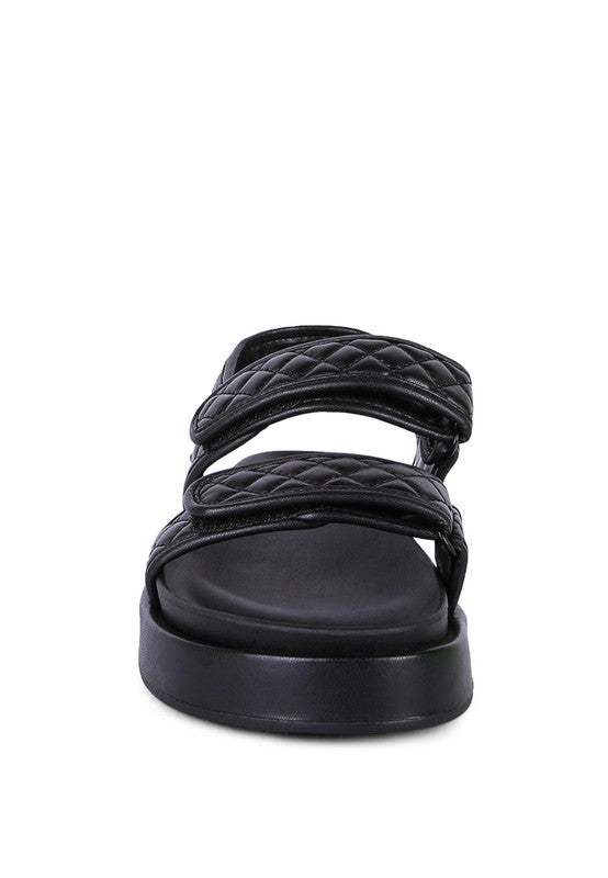 Stylish black women's vacation sandals with comfortable quilted straps for summer outings