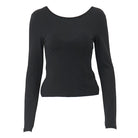 Black backless crop top for women with long sleeves and a fitted silhouette