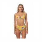 Beach Joy yellow island print bikini set with floral design and adjustable straps on model