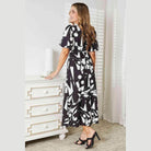 Trendsi women's balloon sleeve vacation dress featuring a modern abstract print and cinched waist