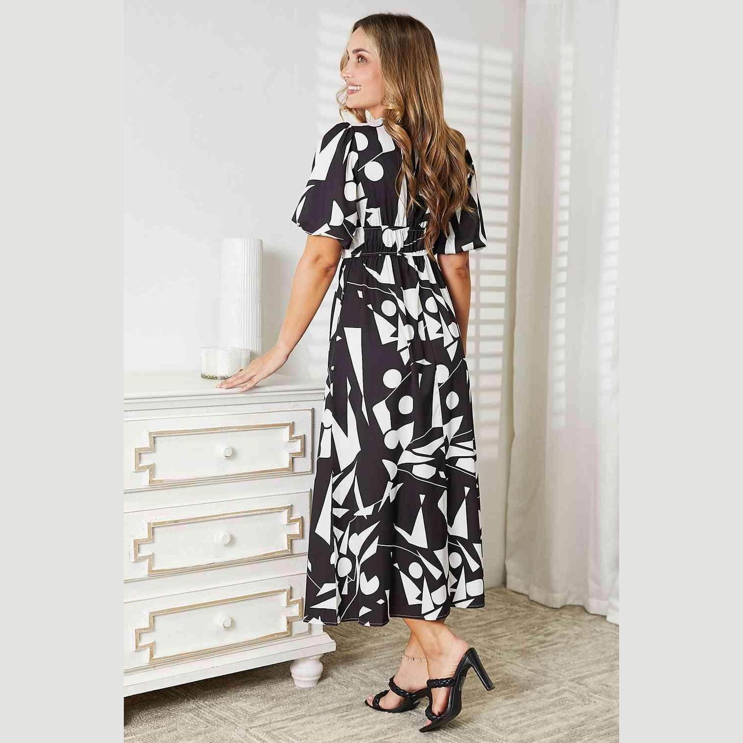 Trendsi women's balloon sleeve vacation dress featuring a modern abstract print and cinched waist