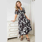 Trendsi women's balloon sleeve vacation dress in a modern black and white geometric print
