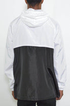 Back view of a black and white anorak for men made of lightweight fabric