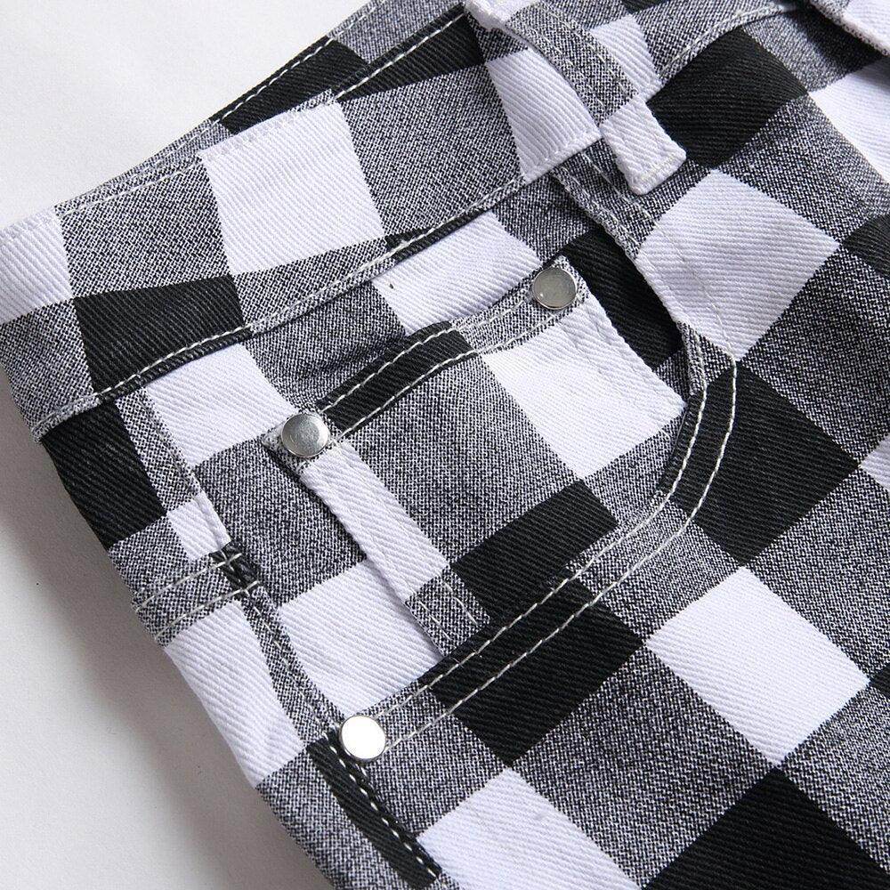 Close-up of VacationGrabs black and white printed jeans with a plaid pattern and stylish details
