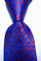 Stylish blue tie featuring black orange dot tie design for men's fashion