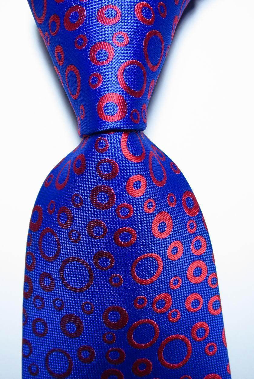 Stylish blue tie featuring black orange dot tie design for men's fashion