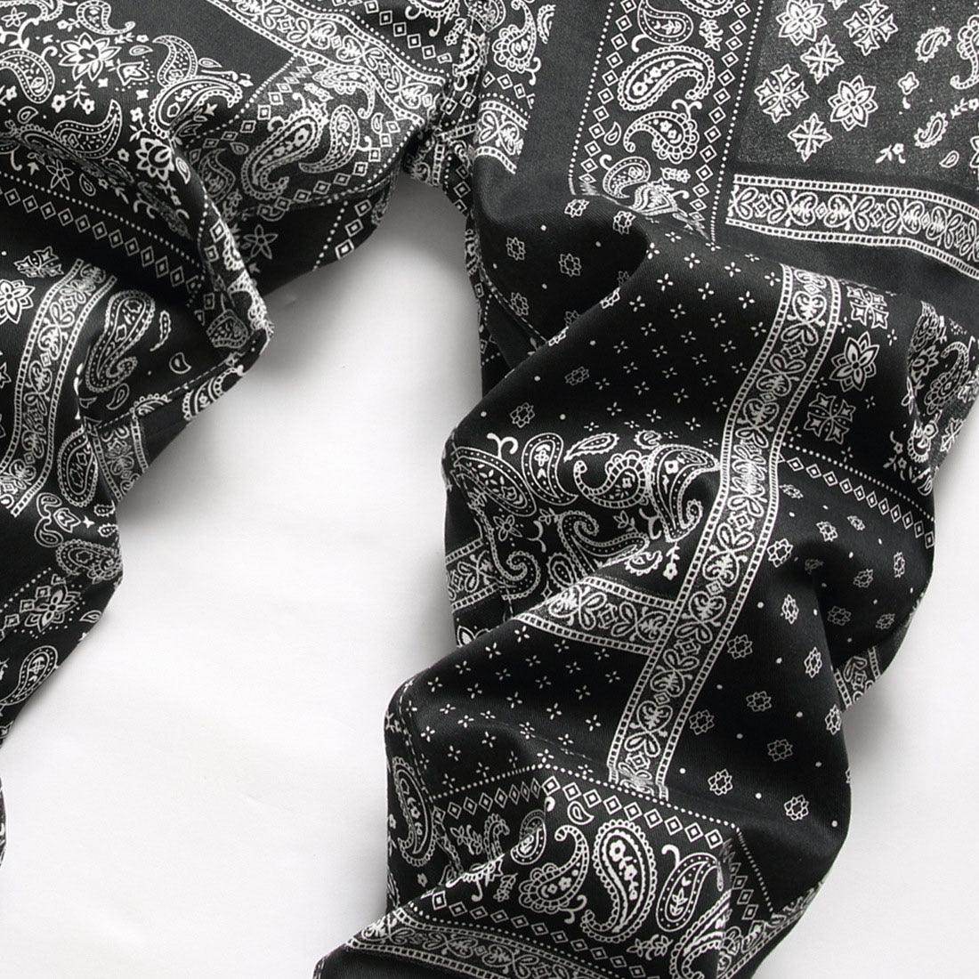 Stylish black printed jeans for men with intricate paisley and geometric patterns